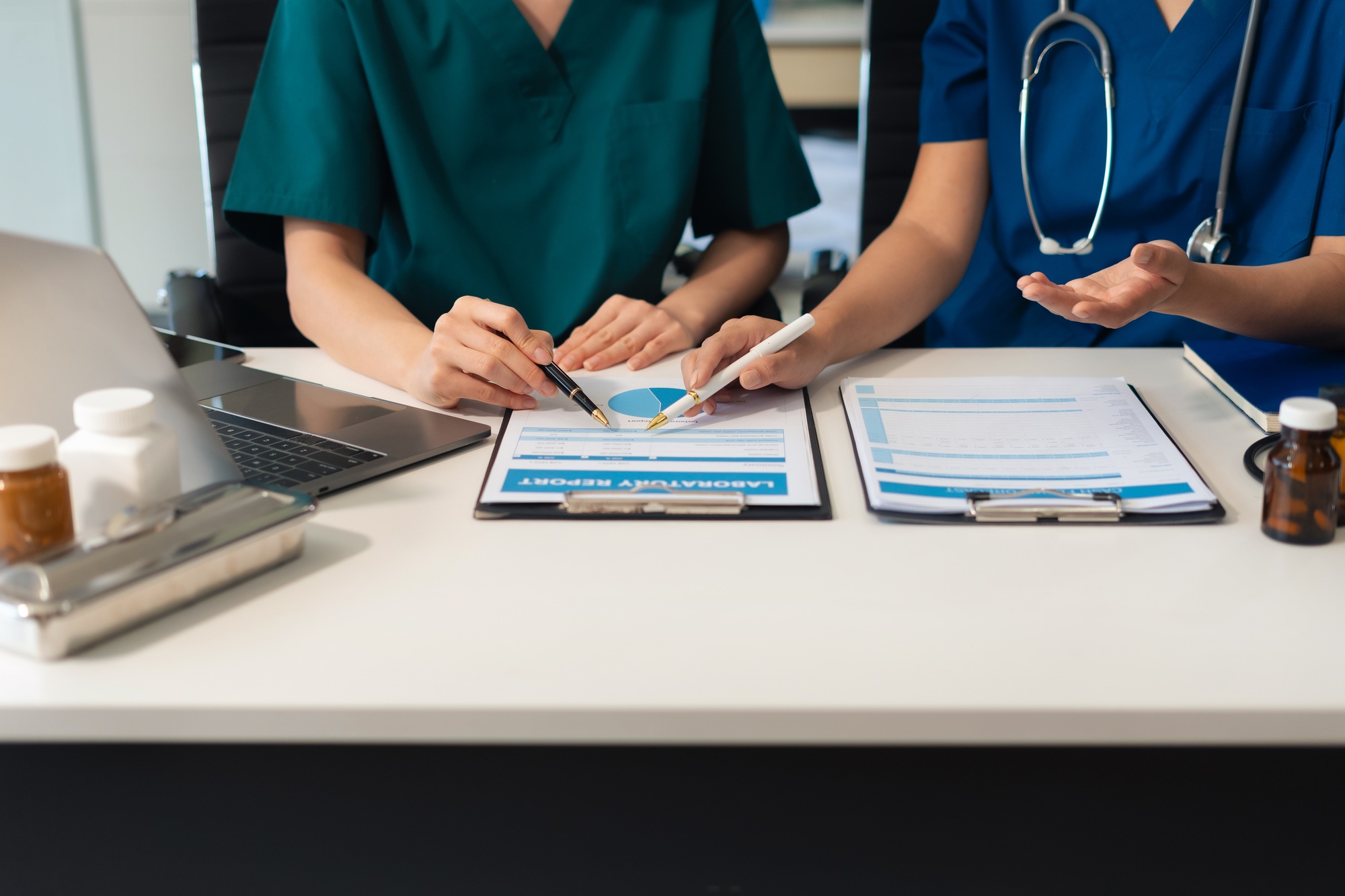 Medical team working analyzed the results of medical reports.