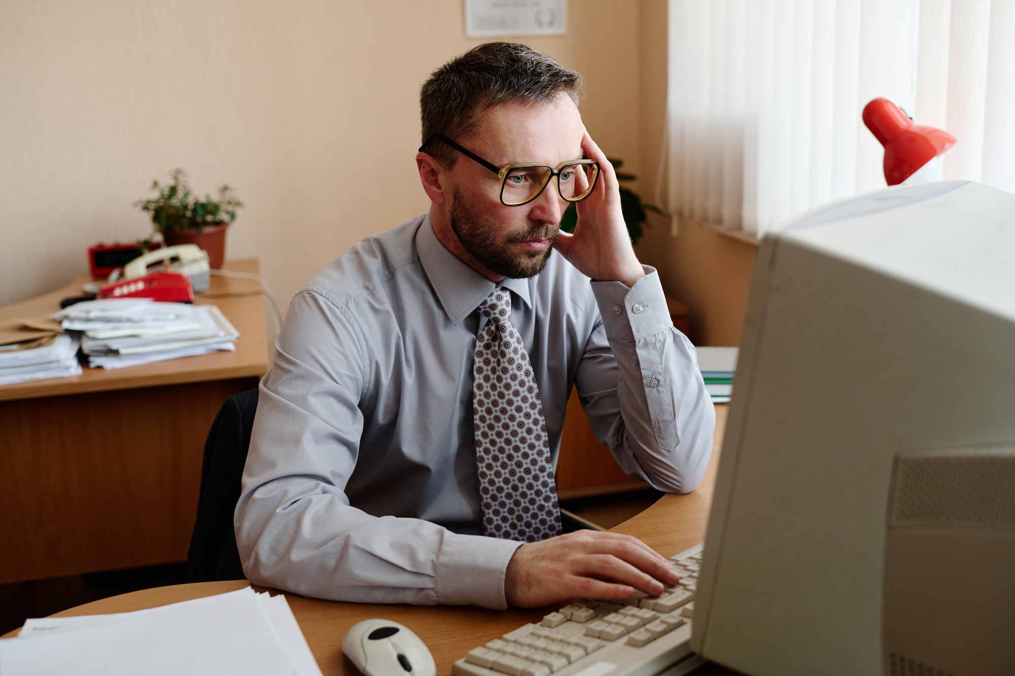 Portrait of Man Working on Computer in Office Setting